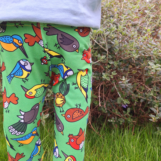 gender free green childrens leggings in a mix of British garden birds print fabric