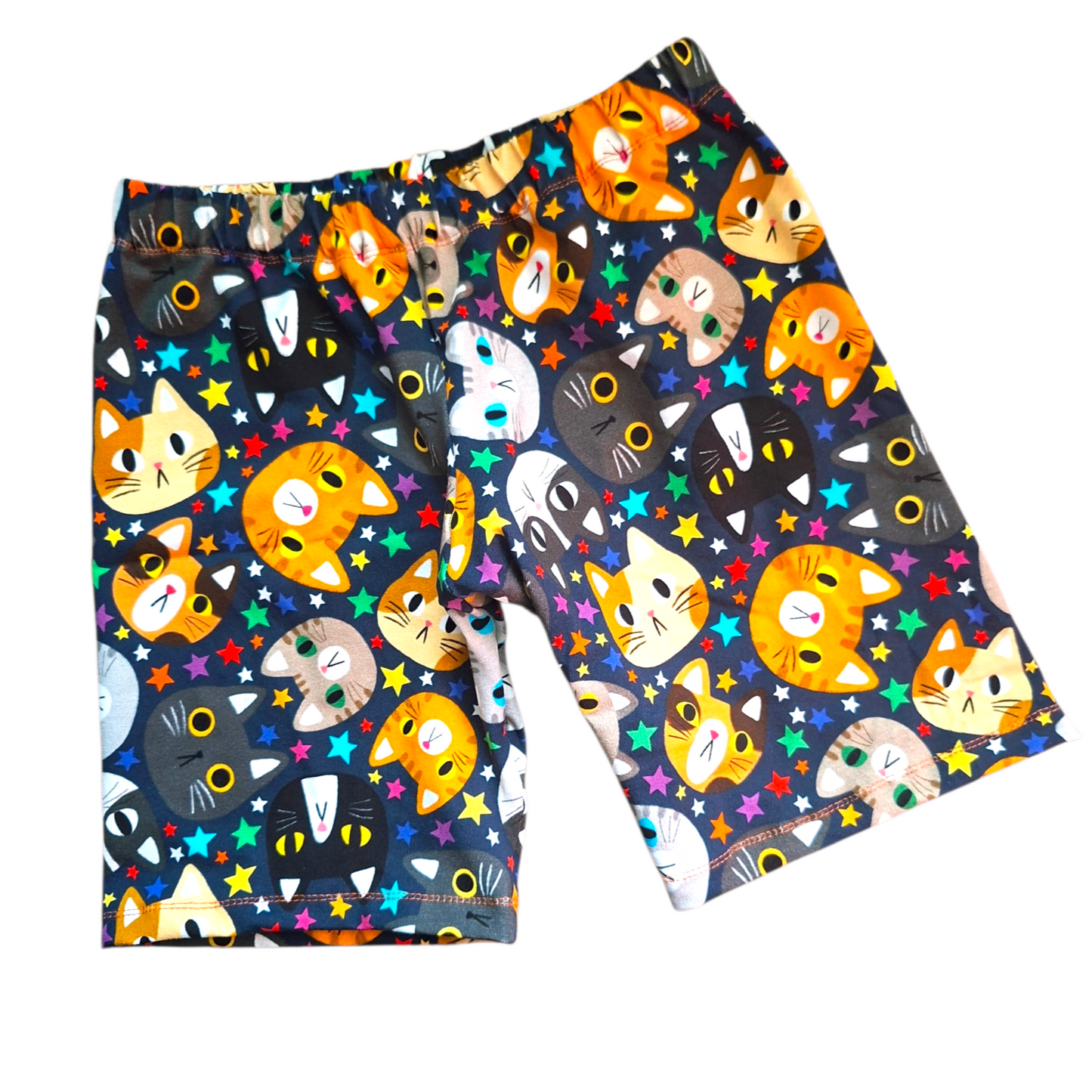 Colorful shorts with cat pattern on a white background
