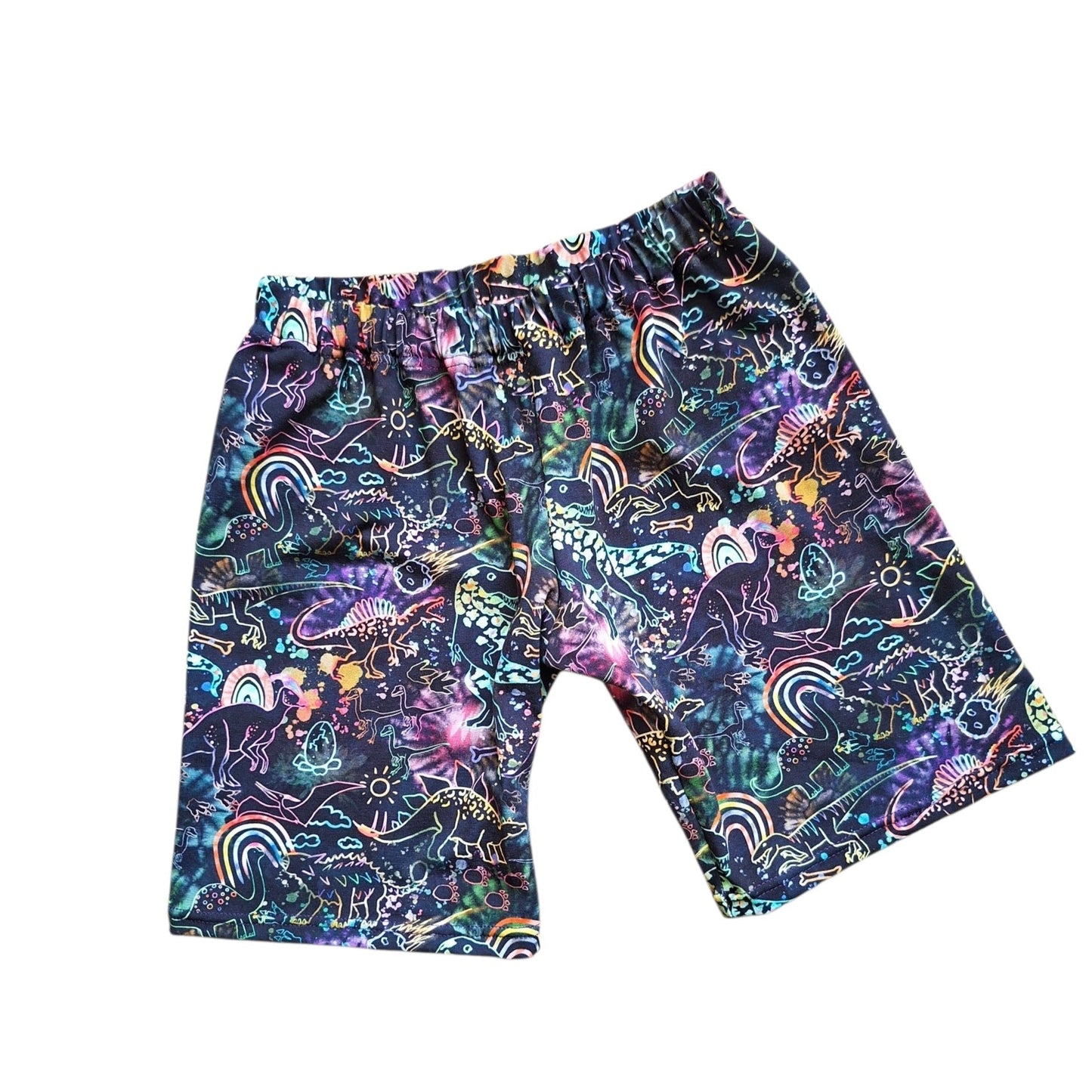 A pair of kids' shorts featuring a vibrant, multicolored psychedelic graffiti pattern on a dark navy base, shown flat against a plain white background.