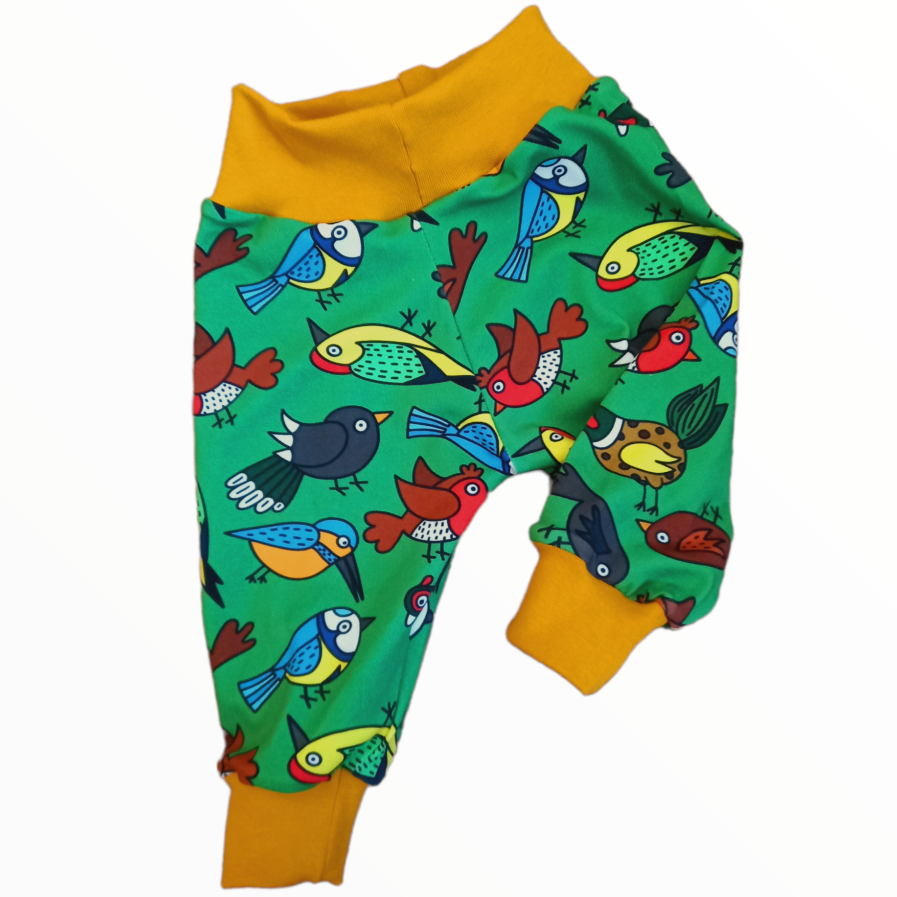 Cloth nappy friendly childrens trousers in a nature design on a green fabric with British garden birds