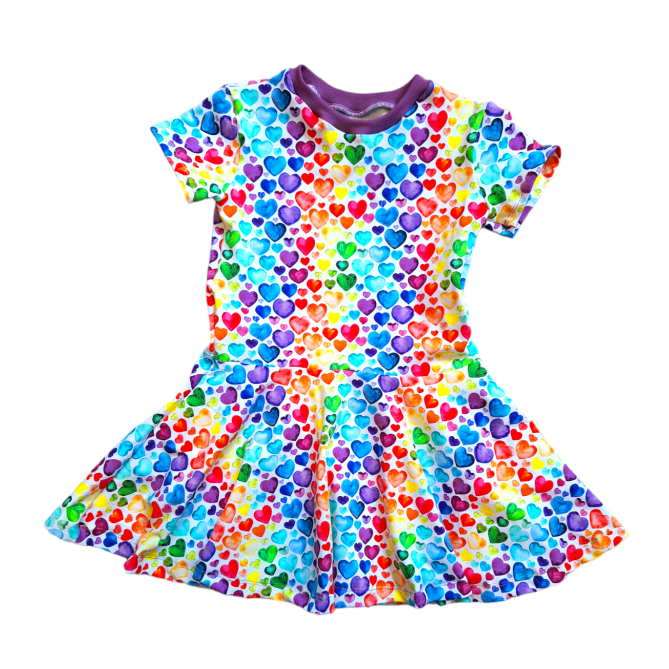 Childrens twirly swirly dress with pockets in a rainbow mix of hearts