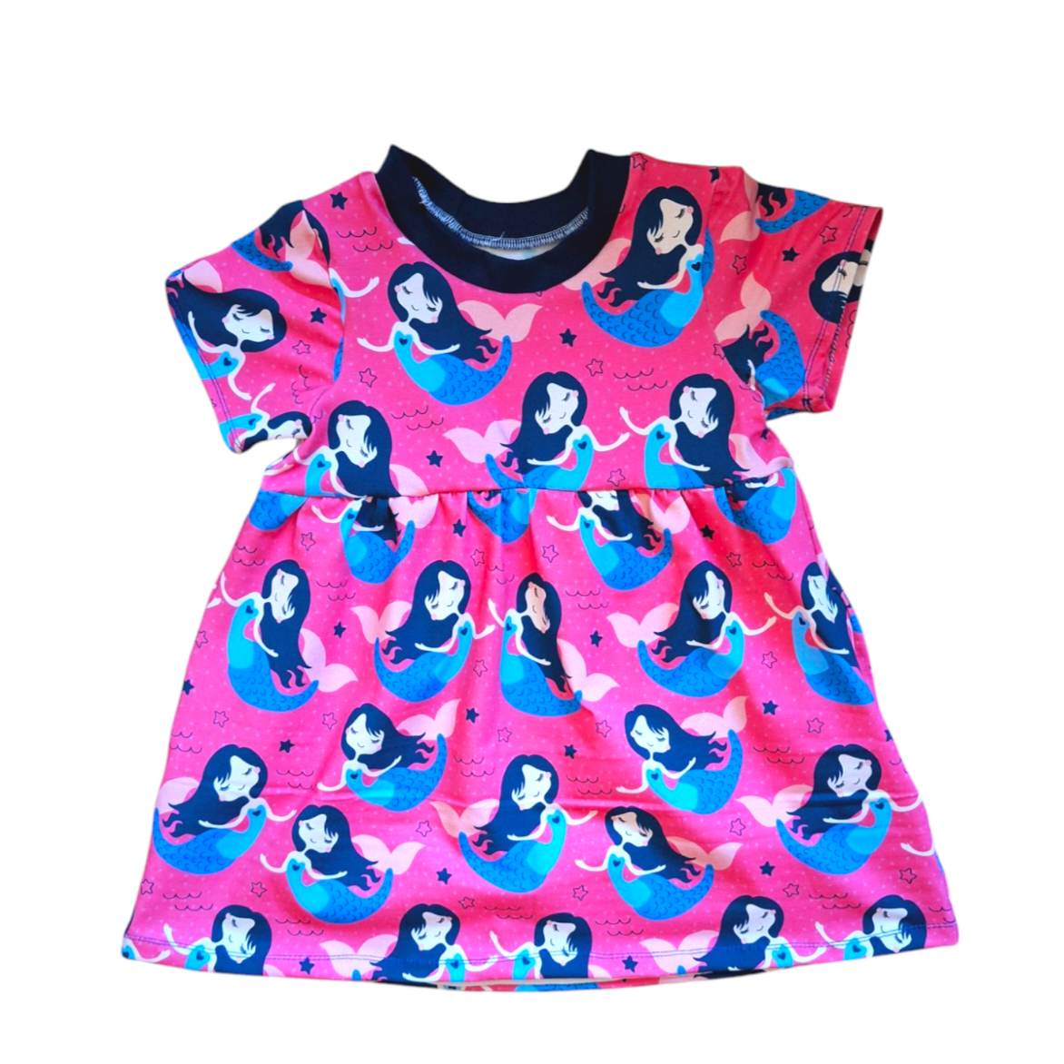 Child's dress with pink background and mermaids