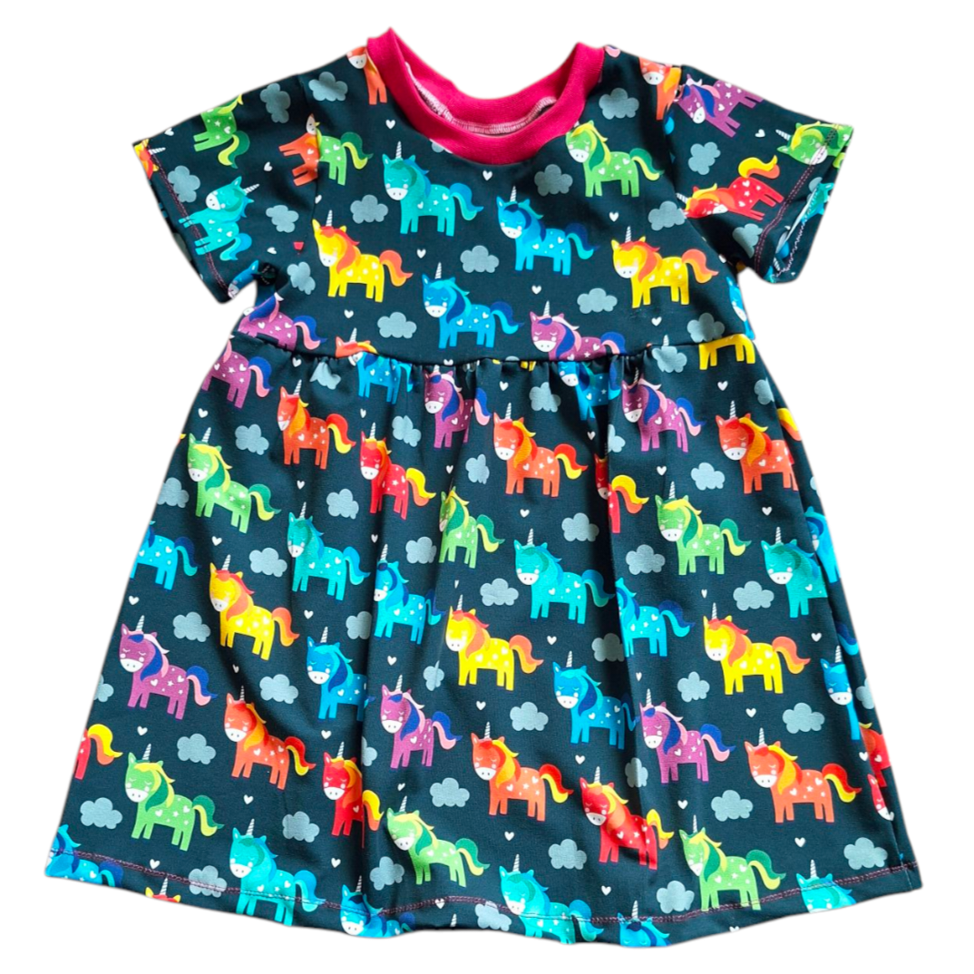 Colourful children's dress with gathered waist and rainbow mix of unicorns