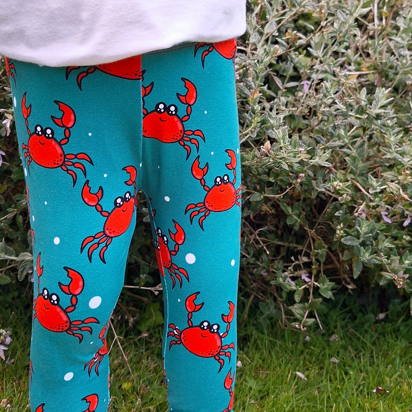Blue children's leggings with a red crab design