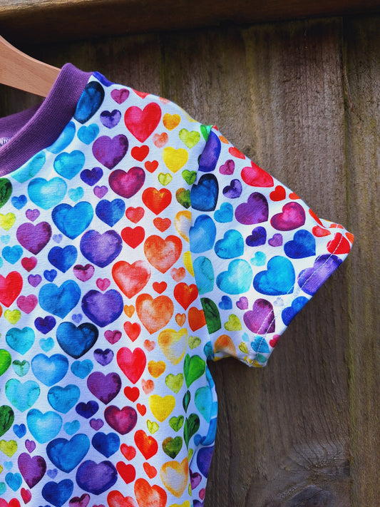 Childrens skater dress in a rainbow heart print fabric