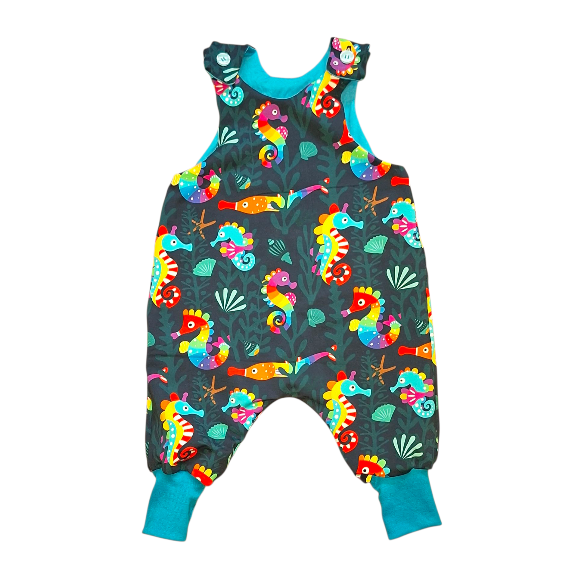 Colourful children's dungarees with seahorse pattern on a white background