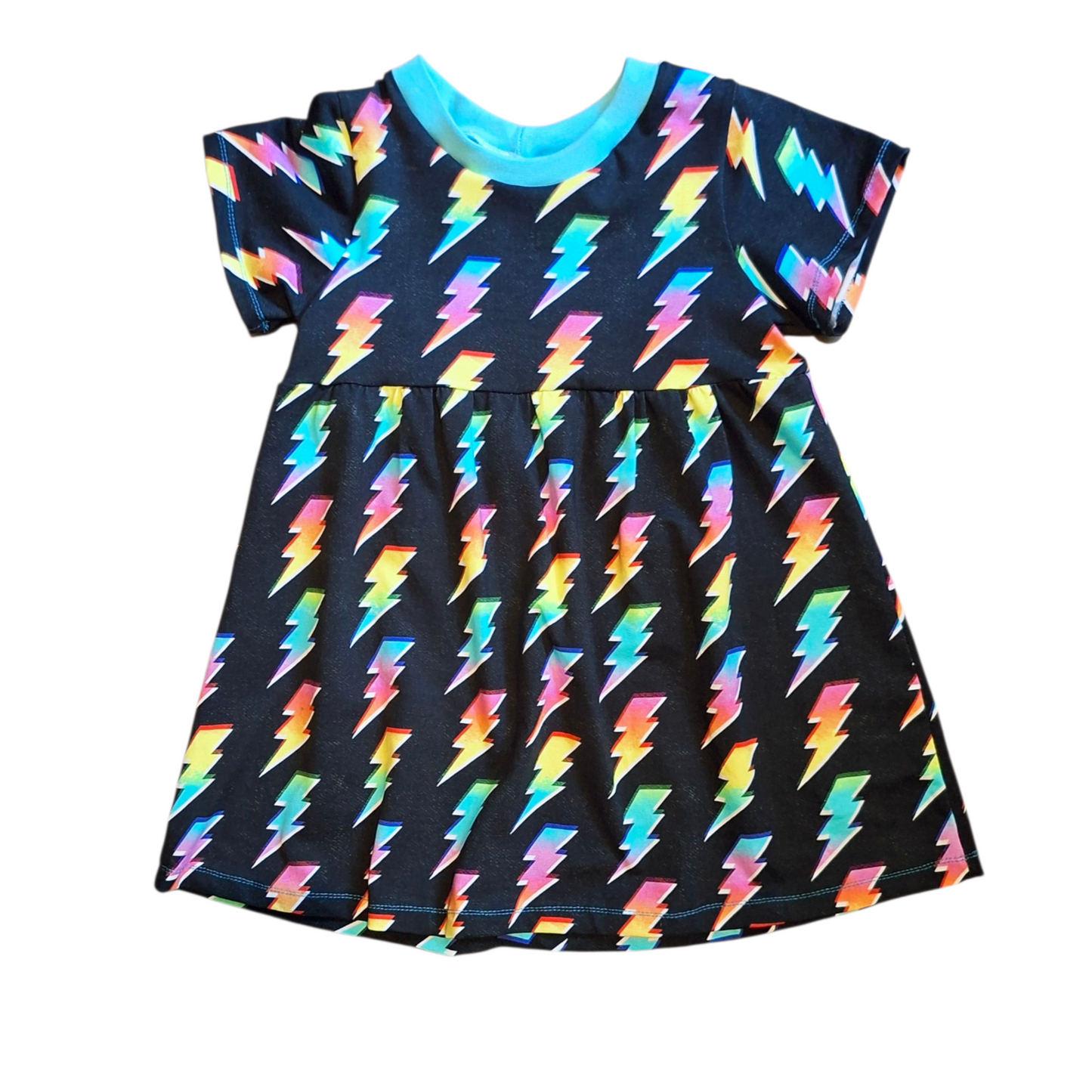 Dress with colourful lightning bolt pattern on a black background
