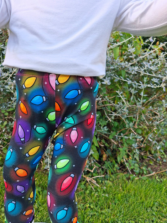 Colorful patterned leggings worn by a person outdoors.