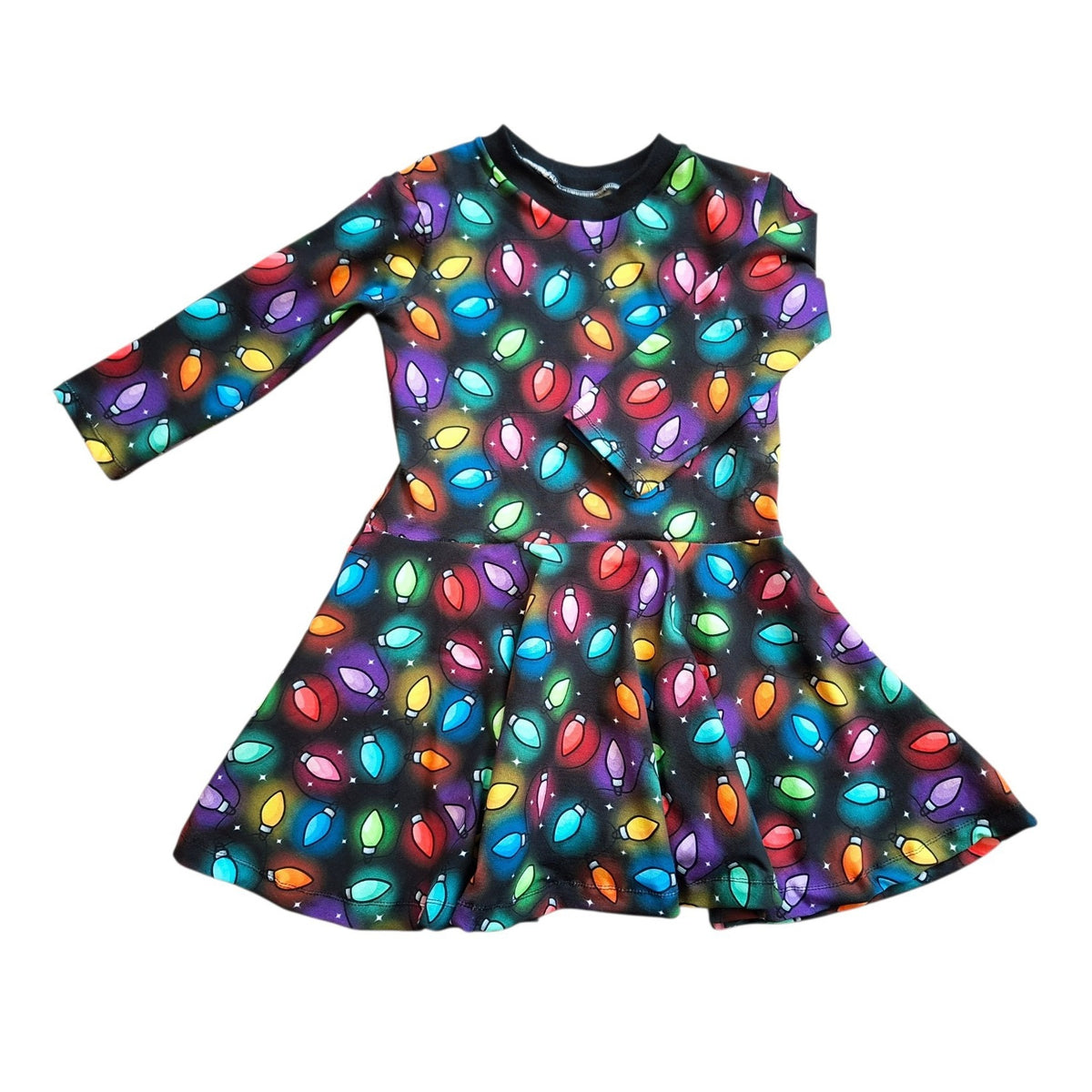A long-sleeve kids' dress with a colorful Christmas light pattern on a black background, shown flat against a white background.