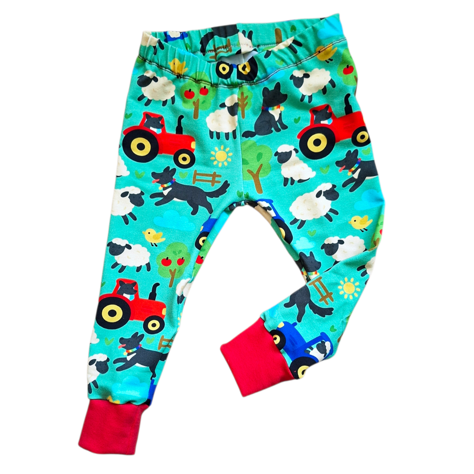 Children's leggings with farm animal and tractor pattern on a white background