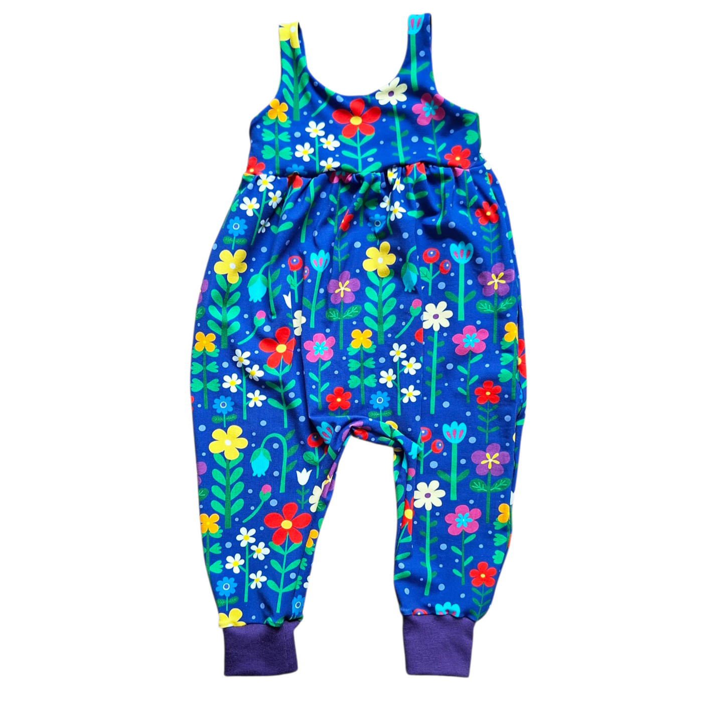 Colorful floral-patterned romper on a white background