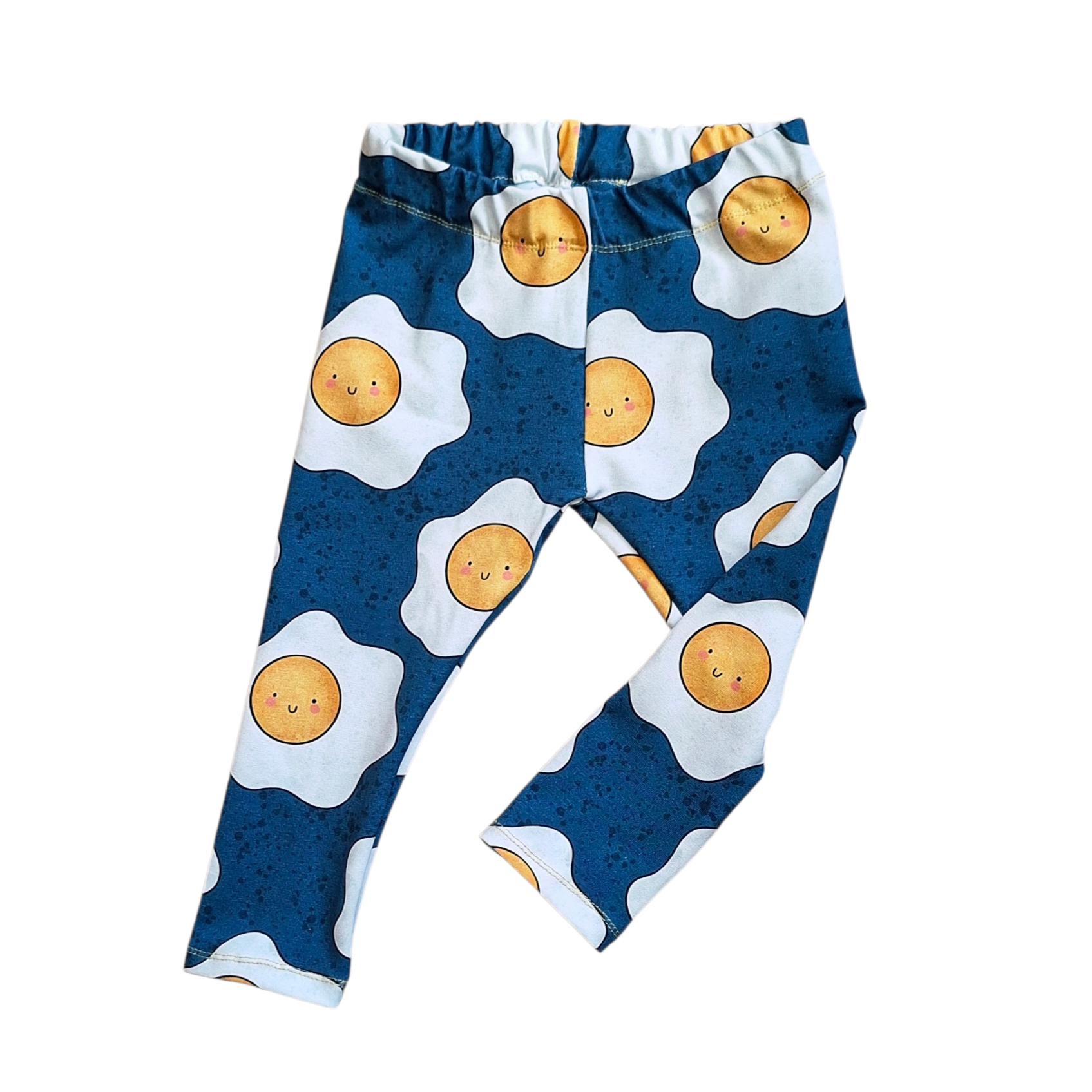 Pants with sunny-side-up egg pattern on a white background