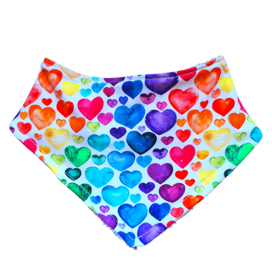 rainbow heart print dribble bib on a white fabric