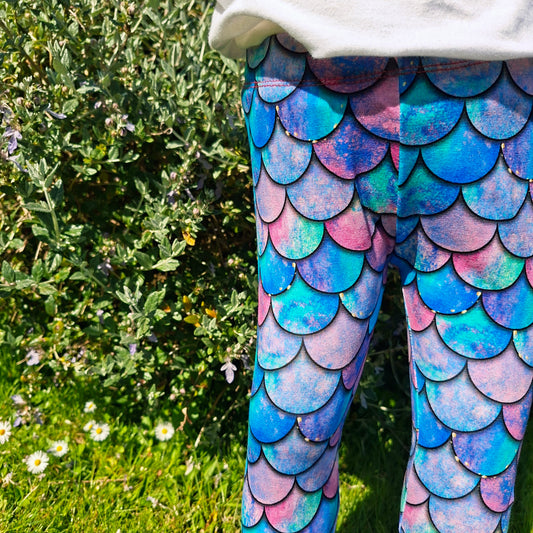 Children's mermaid scale leggings in shades of pink and blue