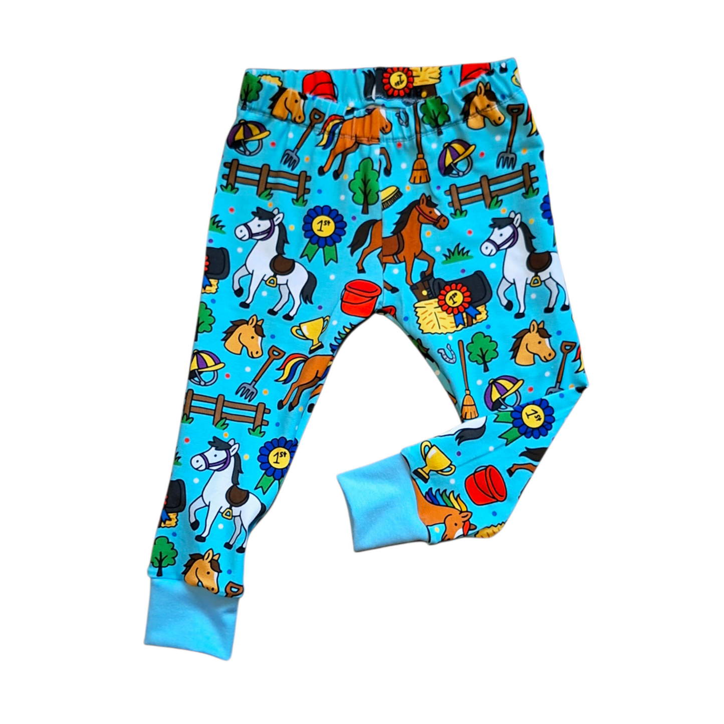 Children's leggings with horse pattern on a blue background