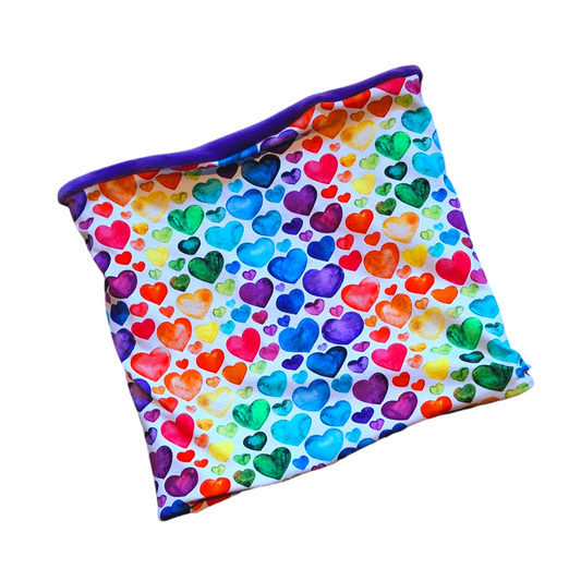 A multicolored heart-patterned snood with a purple edge, likely made of soft fabric suitable for warmth.
