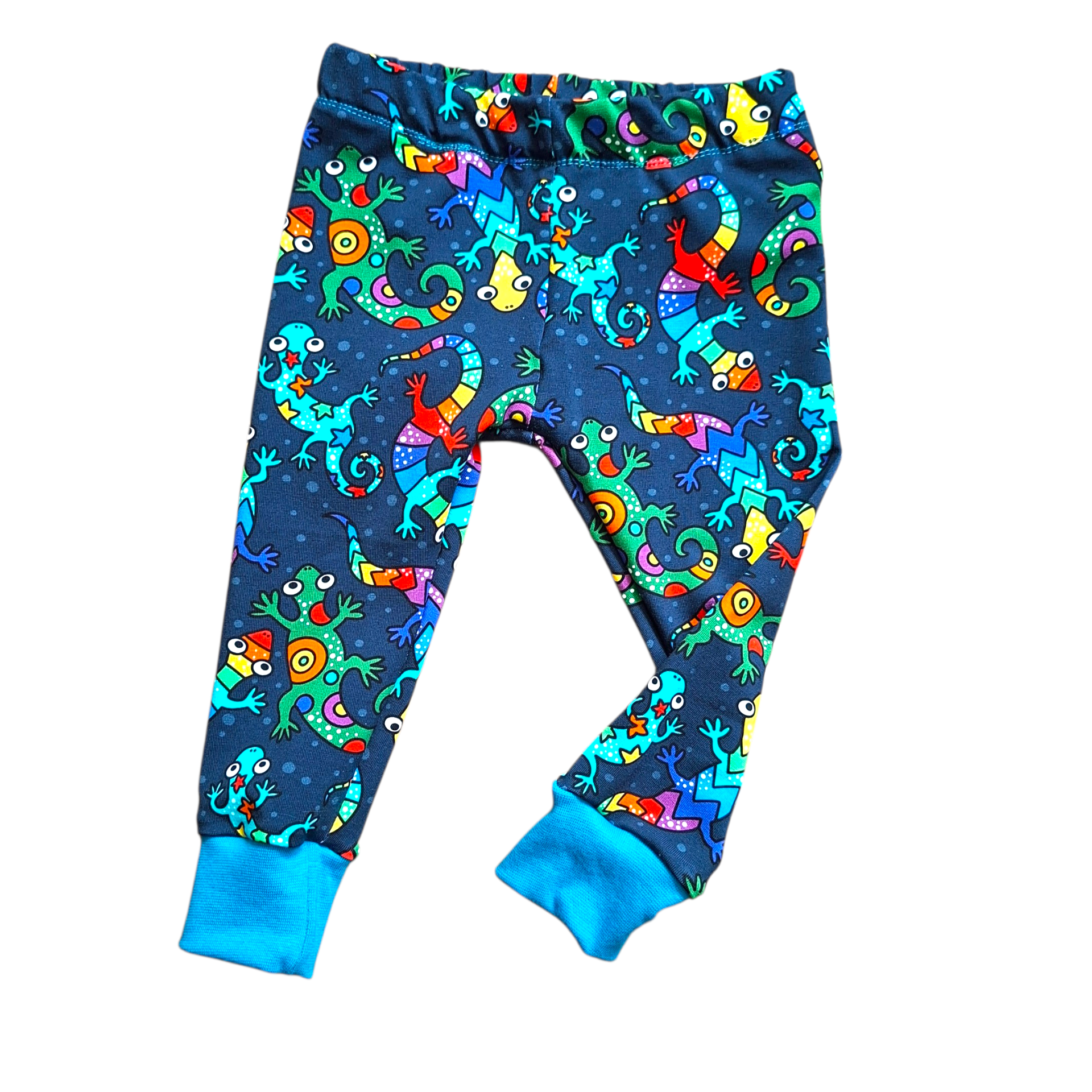 Colorful children's leggings with lizard pattern on a white background