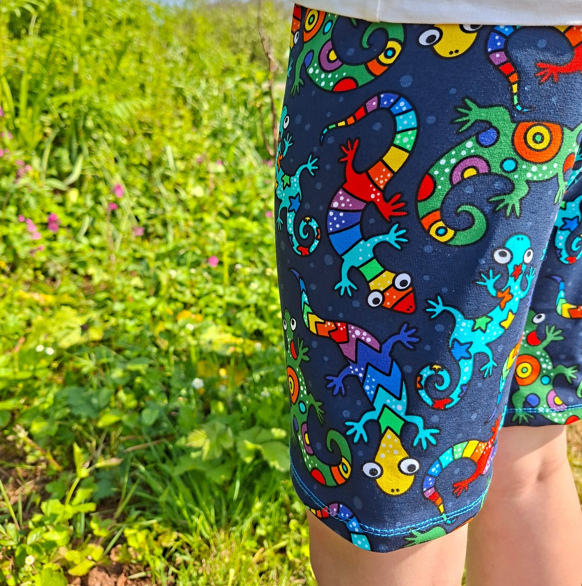 Children's shorts in a bright, rainbow lizard print fabric