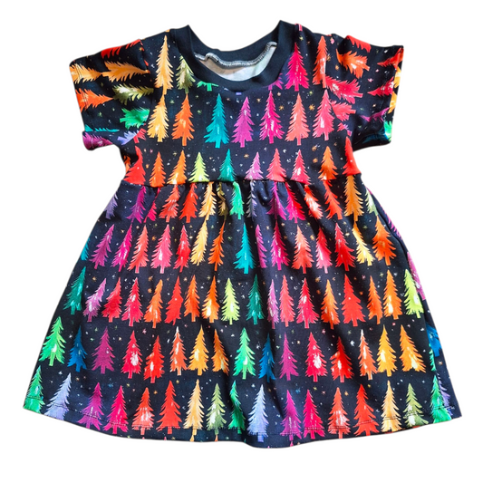 Dress with colourful tree pattern on a white background