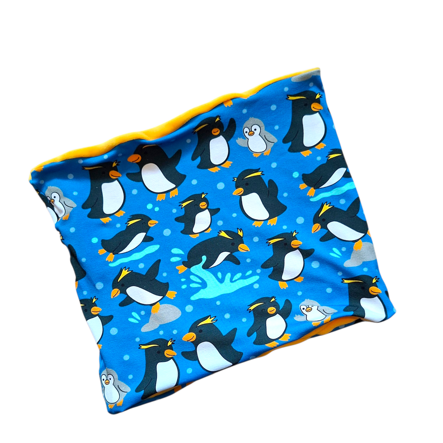 Fabric with penguin pattern on a blue background