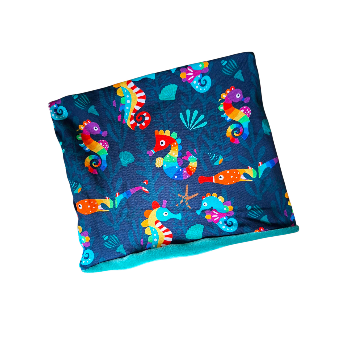 Colorful seahorse patterned fabric on a white background