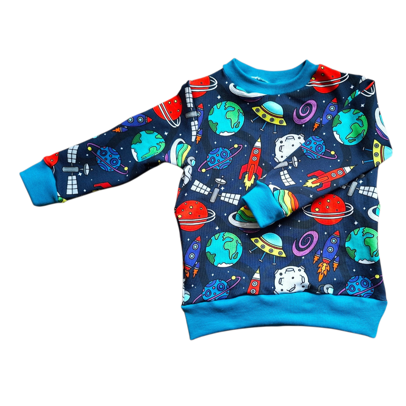 Children's sweatshirt with space-themed design on a white background