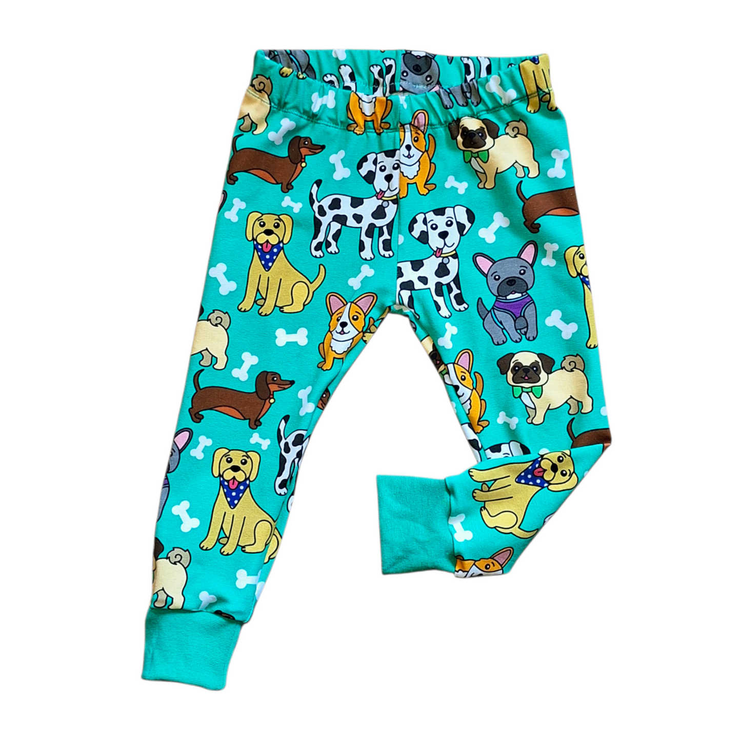 Children's leggings with dog pattern on a turquoise background