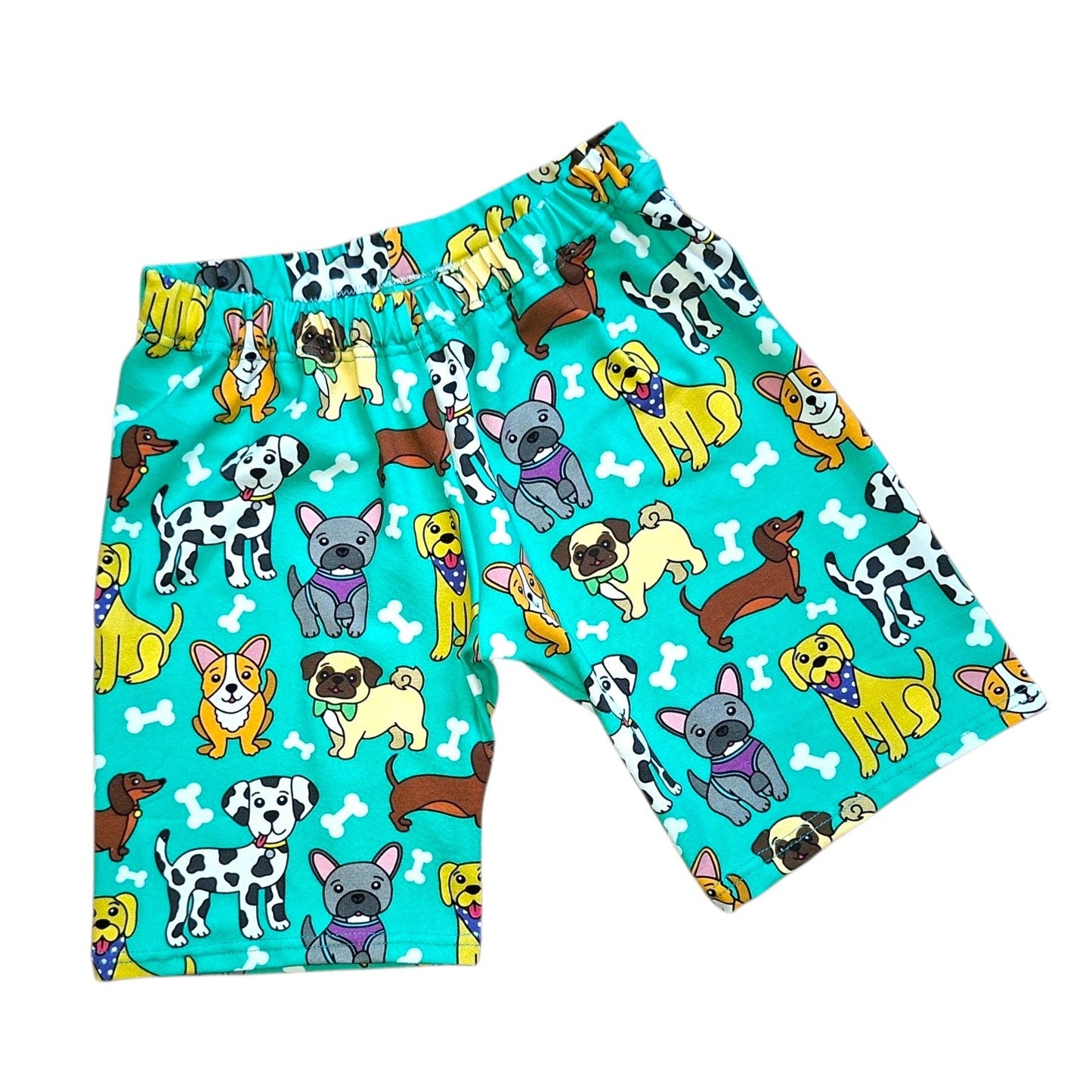 Children's shorts with dog pattern on a turquoise background