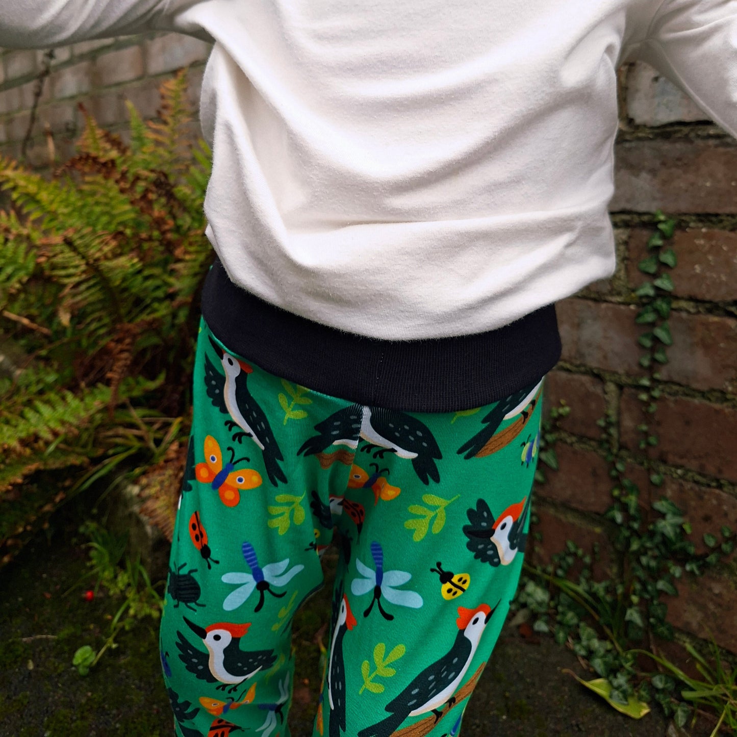 Woodpecker print relaxed fit children's trousers. Perfect for coverinh cloth nappies 