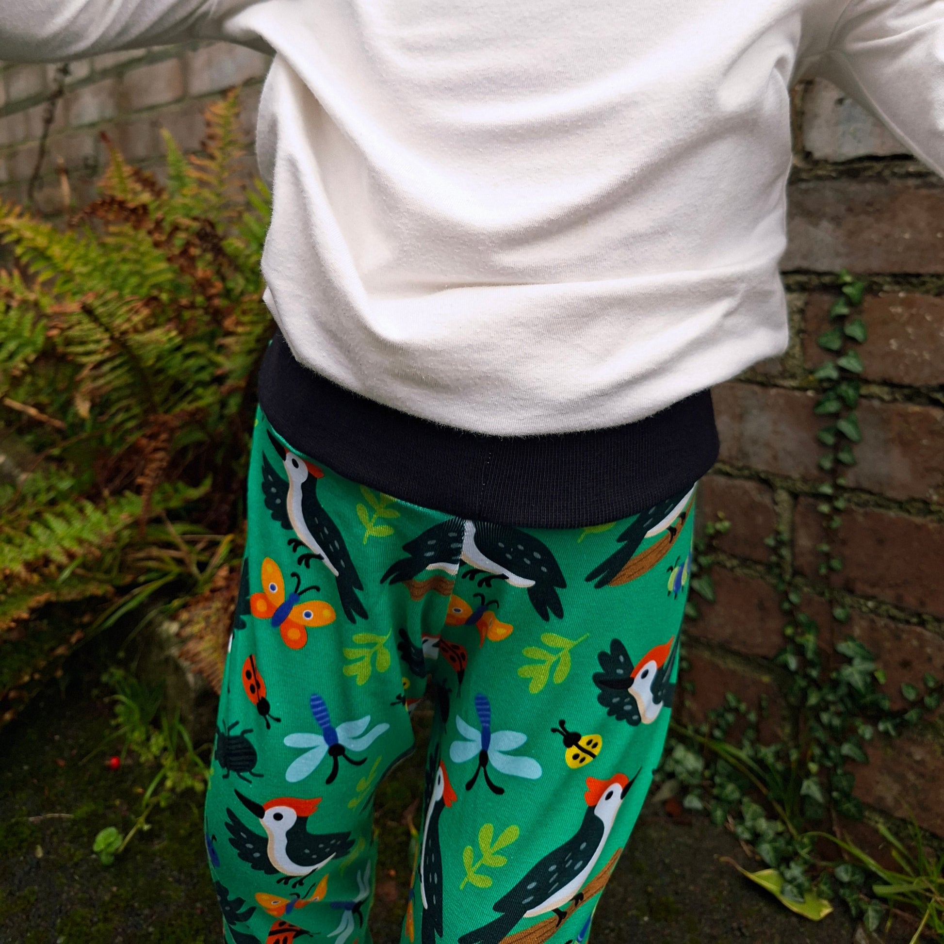 Woodpecker print relaxed fit children's trousers. Perfect for coverinh cloth nappies 