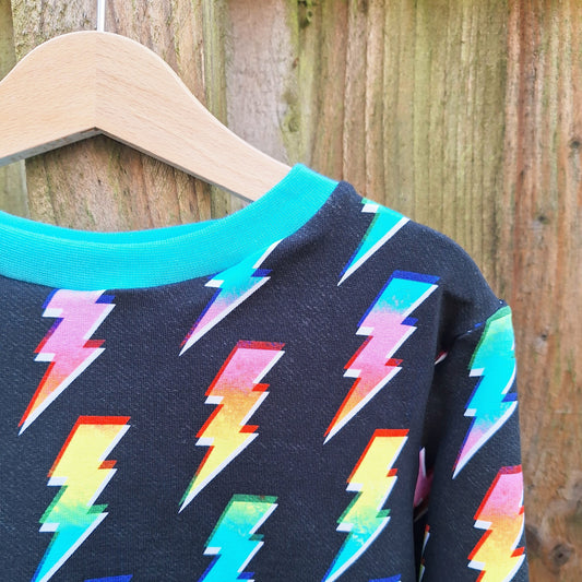 Children's lightning bolt jumper in a mix of bright colours 