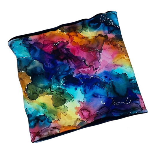 Rainbow Ink Swirl snood with colourful blue, pink, purple, yellow and teal watercolour print
