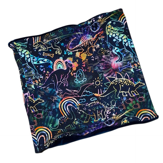 Neon dinosaur print snood with colourful dinosaur outlines and rainbows on a dark background
